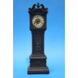 A small metalware long case clock by Ansonin Clock