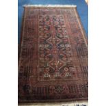 A modern Afghan rug, with triple central medallion, multiple guard stripes and main floral geometric