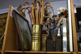 Shelf of assorted pictures, large clock etc.