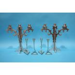 A set of four Chrome candlesticks and a pair of aluminium 3 sconce candelabra