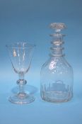 A glass decanter and a large wine glass