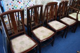 A set of four Edwardian mahogany dining chairs