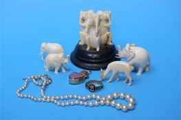 Various carved ivory type items, an 18ct wedding b