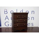 A Victorian mahogany miniature chest of drawers.