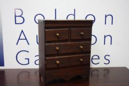 A Victorian mahogany miniature chest of drawers.