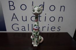 A circa 1950's decorative pottery cat of elongated