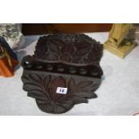 Carved oak pipe rack