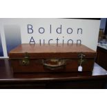 A vintage circa 1920's brown leather suitcase, wit
