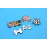 Five various decorative brooches