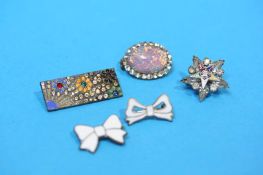 Five various decorative brooches