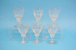 A set of six cut glass wine glasses