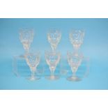 A set of six cut glass wine glasses