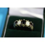 A Victorian 9ct gold opal and garnet set ring