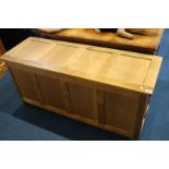 An Acorn Man oak four panelled blanket box 122cm length