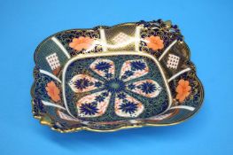 A pair of Royal Crown Derby Imari patterned square dishes with pierced acorn handles, printed