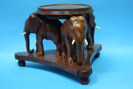 Carved Oriental hardwood elephant stand