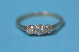 A 9ct gold diamond three stone ring