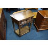 A small oak single drawer side table