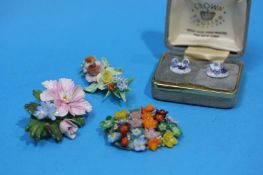 A pair of porcelain bonnet shaped earrings, and three porcelain brooches