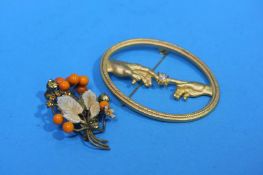 Two decorative dress brooches