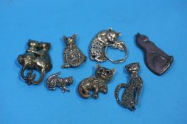 A collection of cat brooches