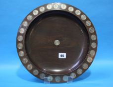 A walnut dish with impressed silver coins