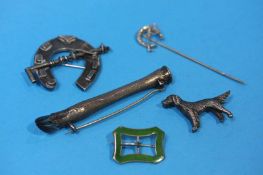 A silver horseshoe and whip brooch, a horse's leg and hoof brooch, a hunting tie pin etc.