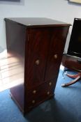 Reproduction mahogany oval coffee table and a HiFi cabinet