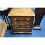 A small pair of walnut chest of drawers, 66cm wide