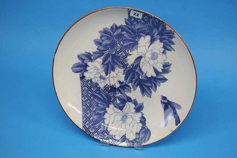 A large Japanese Imari wall plaque decorated with a bird and flowers, 40cm diameter