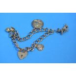 A 9ct gold charm bracelet, weight 26.2 grams