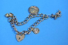 A 9ct gold charm bracelet, weight 26.2 grams