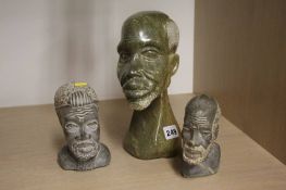 Three carved African heads