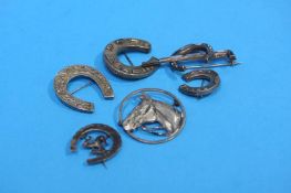 Six various silver and silver coloured hunting brooches, including a horseshoe and whip inset with