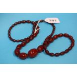 A long amber coloured necklace