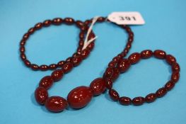 A long amber coloured necklace