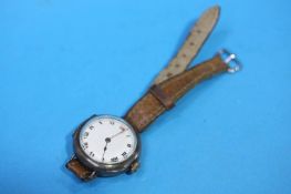 A 1920's Rolex wristwatch with white dial and Romen numerals, stamped Rolex 15 jewels and numbered