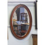 A Mahogany oval mirror 87 x 62cm