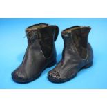 A pair of childs Victorian leather boots