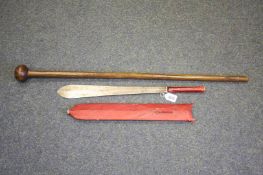 A Knobkerrie and an African sword in leather scabbard