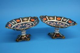 A pair of Royal Crown Derby Imari pattern pedestal tazza's; printed mark numbered 8706, 27cm length