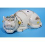 A Continental porcelain sleeping cat