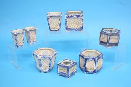 A collection of Chinese blue and white miniature lattice work sided pots (8)