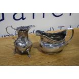A Victorian silver cream jug and another.
