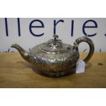 A Victorian silver squat shaped tea pot, London 18