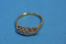 An 18ct gold five stone graduated Diamond ring
