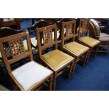 A set of Mouseman style lattice work chairs by Lyndon Hammell, carved with a 'cats' head.