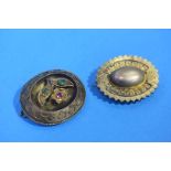 Two Victorian gilt metal mourning brooches