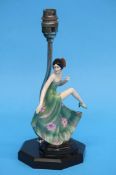 A 1930's Art Deco porcelain figure of a dancing gi