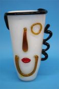 A Murano white glass vase with facial features, 32